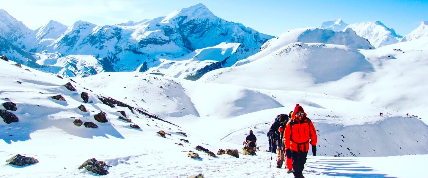 "Climbers scaling the majestic Chulu West Peak."